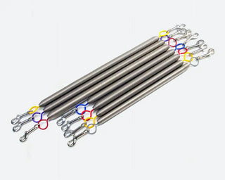 Heavy-duty Pilates reformer springs with color-coded hooks for resistance training.