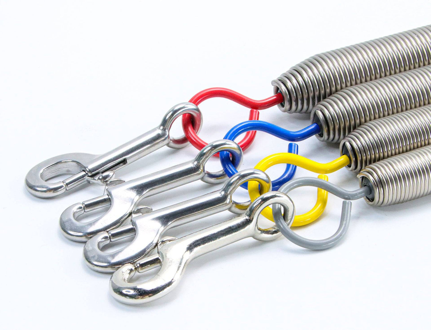 Detailed view of Balanced Body Pilates Trapeze Springs with durable snap clips and multi-colored hooks for Cadillac and Springboard setups.